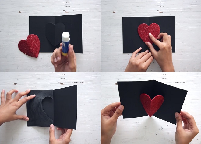 Dán giấy trái tim màu đỏ đã cắt bằng kim tuyến vào trái tim màu đen và dán thêm giấy bìa vào mặt sau để che đi khoảng trống.