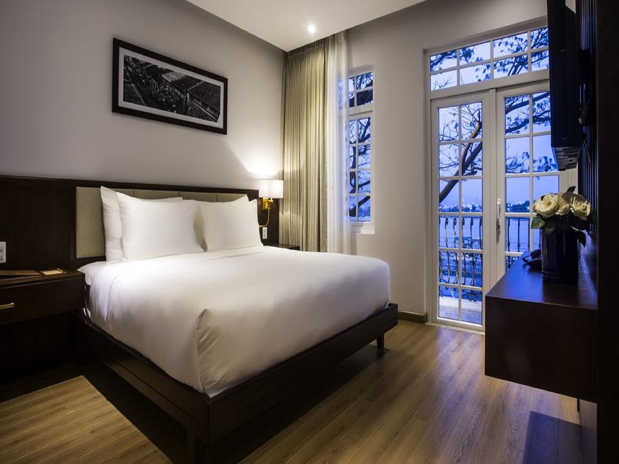 giường ngủ cực kỳ êm ái của Di Lusso Boutique Hotel